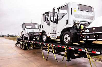 mullen three trucks on trailer